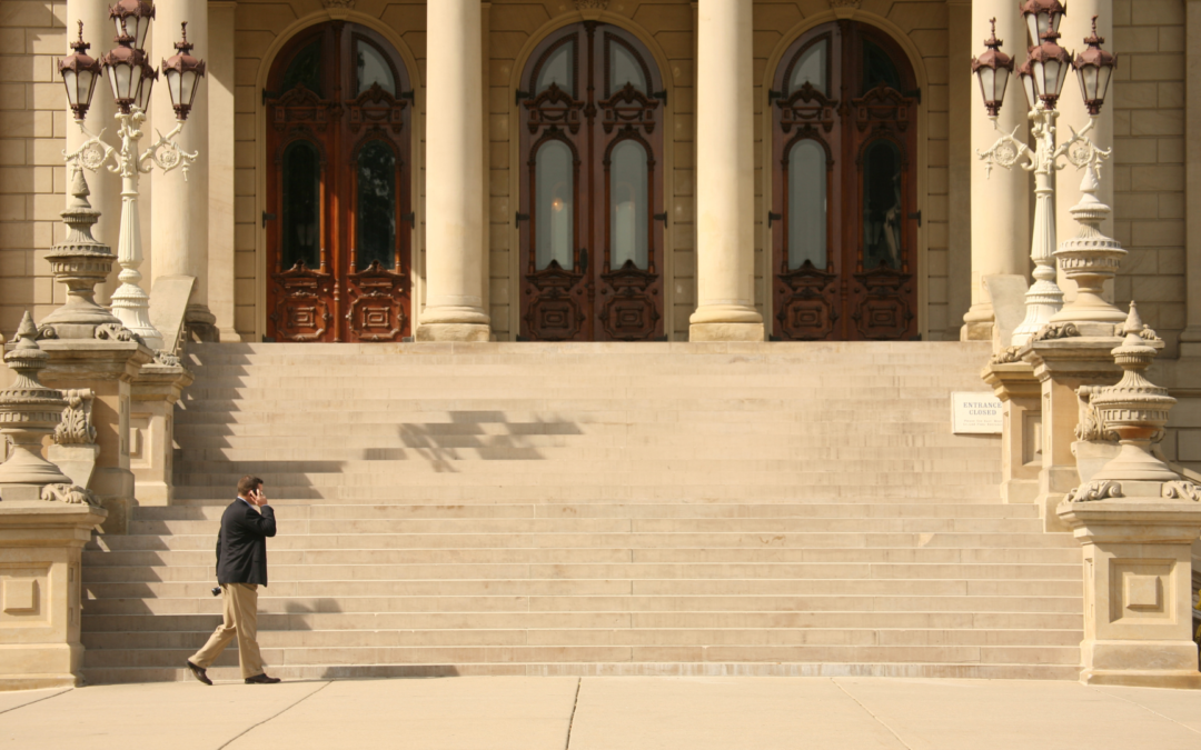man walking into capitol building